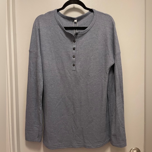 Teal button up shirt by the brand est. 1946. No
